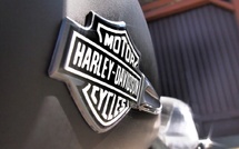 Harley-Davidson cuts quarterly net profit in half