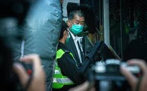 Former Hong Kong media mogul sentenced to 20 years in prison in national security case